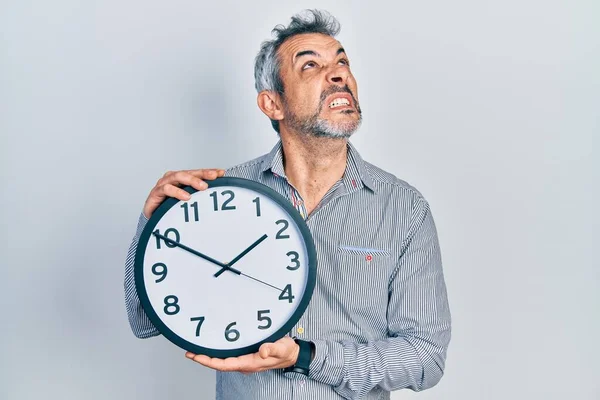 Handsome Middle Age Man Grey Hair Holding Big Clock Angry — Fotografia de Stock