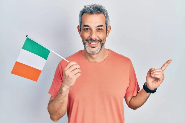 Handsome Middle Age Man Grey Hair Holding Ireland Flag Smiling — 스톡 사진