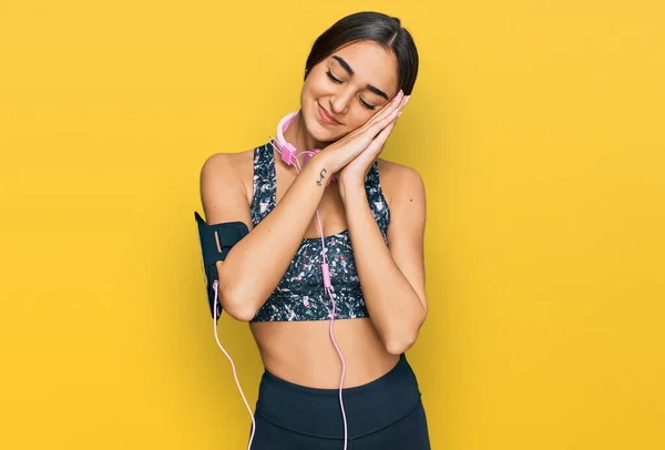 Beautiful Brunette Woman Wearing Gym Clothes Using Headphones Sleeping Tired — 스톡 사진
