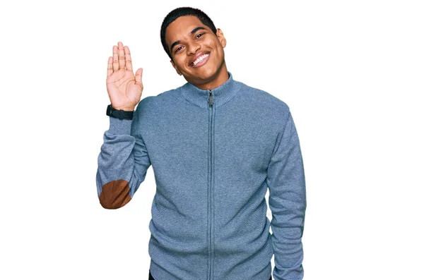 Young Handsome Hispanic Man Wearing Casual Sweatshirt Waiving Saying Hello — Stock Photo, Image