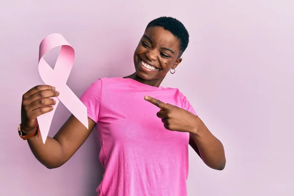 Young African American Woman Holding Pink Cancer Ribbon Smiling Happy — Zdjęcie stockowe
