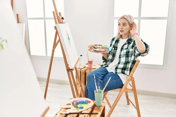 Young Artist Woman Painting Canvas Art Studio Smiling Hand Ear — Zdjęcie stockowe