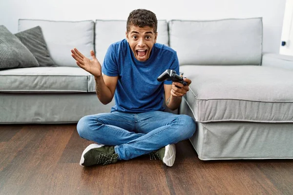 Young Handsome Hispanic Man Playing Video Game Sitting Sofa Celebrating — Stock Photo, Image