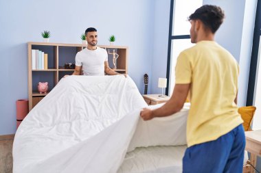 Two man couple doing bed at bedroom