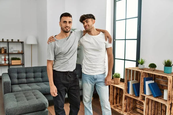 Two Hispanic Men Couple Smiling Confident Hugging Each Other Home — Stockfoto