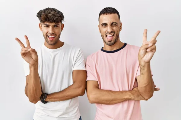 Young Gay Couple Standing Isolated Background Smiling Happy Face Winking — Stock Fotó