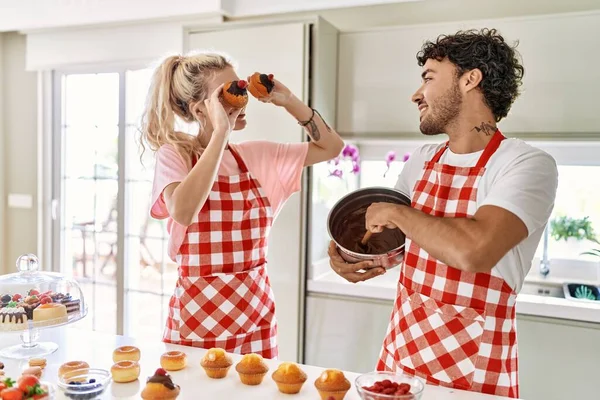 Young Couple Smiling Happy Cooking Sweets Holding Pumpkin Eyes Kitchen — Stock Photo, Image