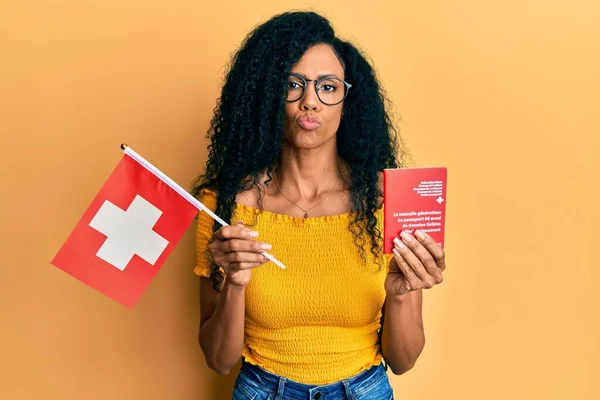 Middle Age African American Woman Holding Swiss Flag Passport Looking — Stockfoto