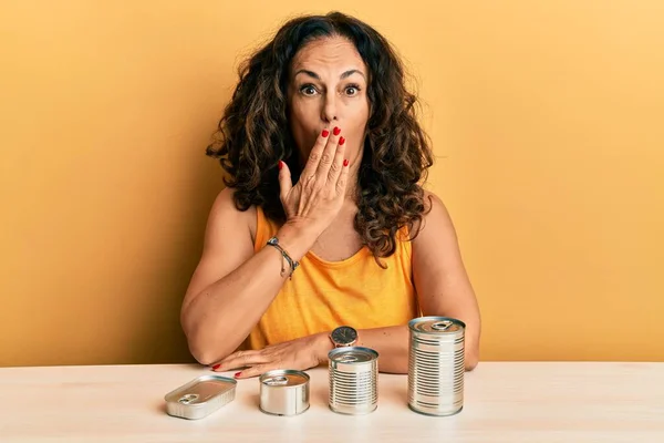 Beautiful Middle Age Woman Canned Food Covering Mouth Hand Shocked — Fotografia de Stock