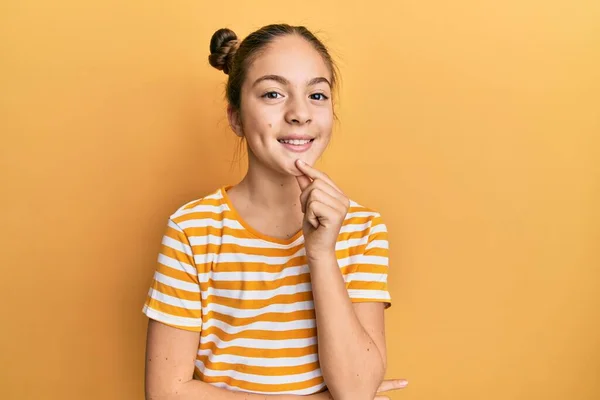 Beautiful Brunette Little Girl Wearing Casual Striped Shirt Looking Confident — Stock Photo, Image