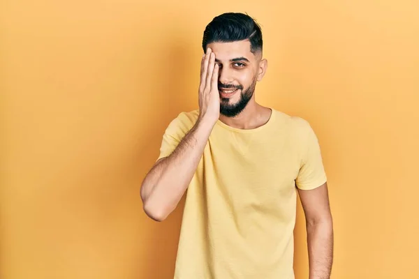 Handsome Man Beard Wearing Casual Yellow Shirt Covering One Eye — Stock fotografie