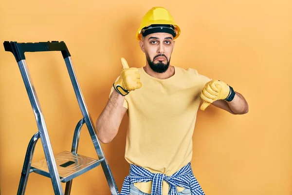 Handsome Man Beard Construction Stairs Wearing Hardhat Doing Thumbs Disagreement — 스톡 사진