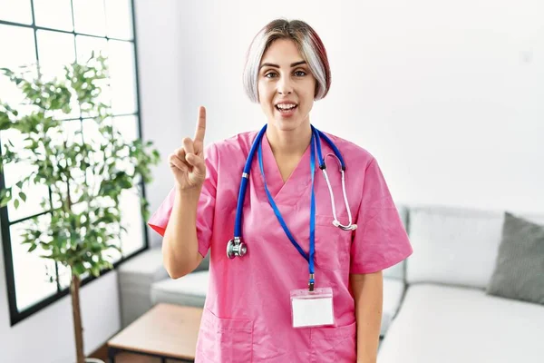 Young Beautiful Woman Wearing Doctor Uniform Stethoscope Showing Pointing Finger — Photo