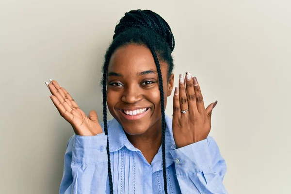 African American Woman Braided Hair Wearing Engagement Ring Celebrating Victory — стоковое фото