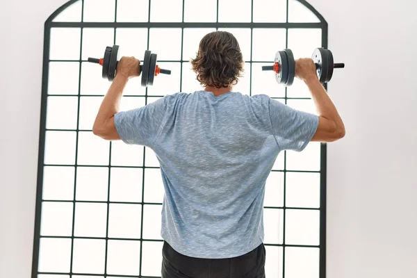 Middle Age Caucasian Man Back View Training Using Dumbbells Sport - Stock-foto