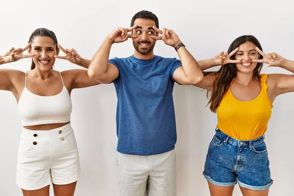 Group Young Hispanic People Standing Isolated Background Doing Peace Symbol — Stockfoto