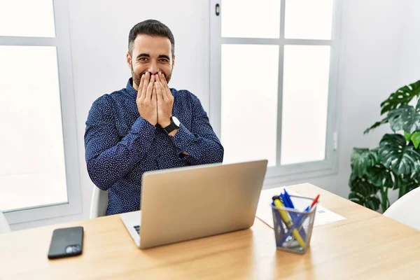 Young Hispanic Man Beard Working Office Laptop Laughing Embarrassed Giggle — Stockfoto
