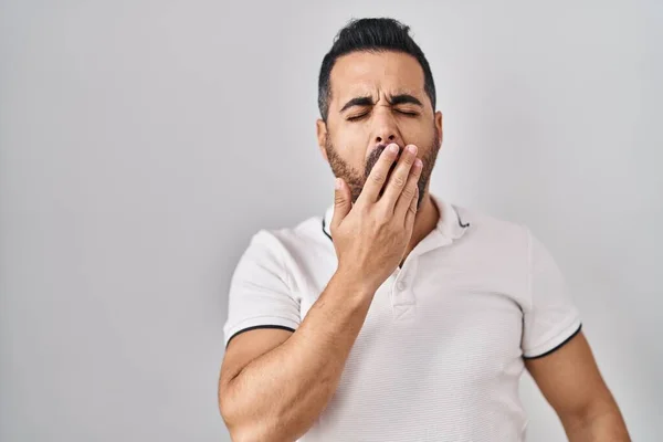 Young Hispanic Man Beard Wearing Casual Clothes White Background Bored — стоковое фото