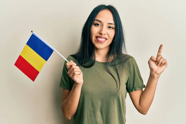 Young Hispanic Girl Holding Romania Flag Smiling Happy Pointing Hand — Stockfoto