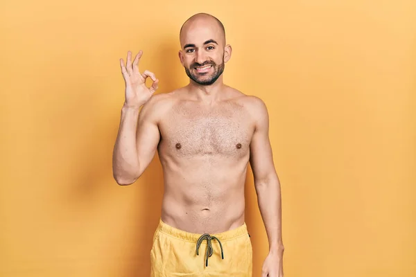 Young Bald Man Wearing Swimwear Smiling Positive Doing Sign Hand — Foto de Stock