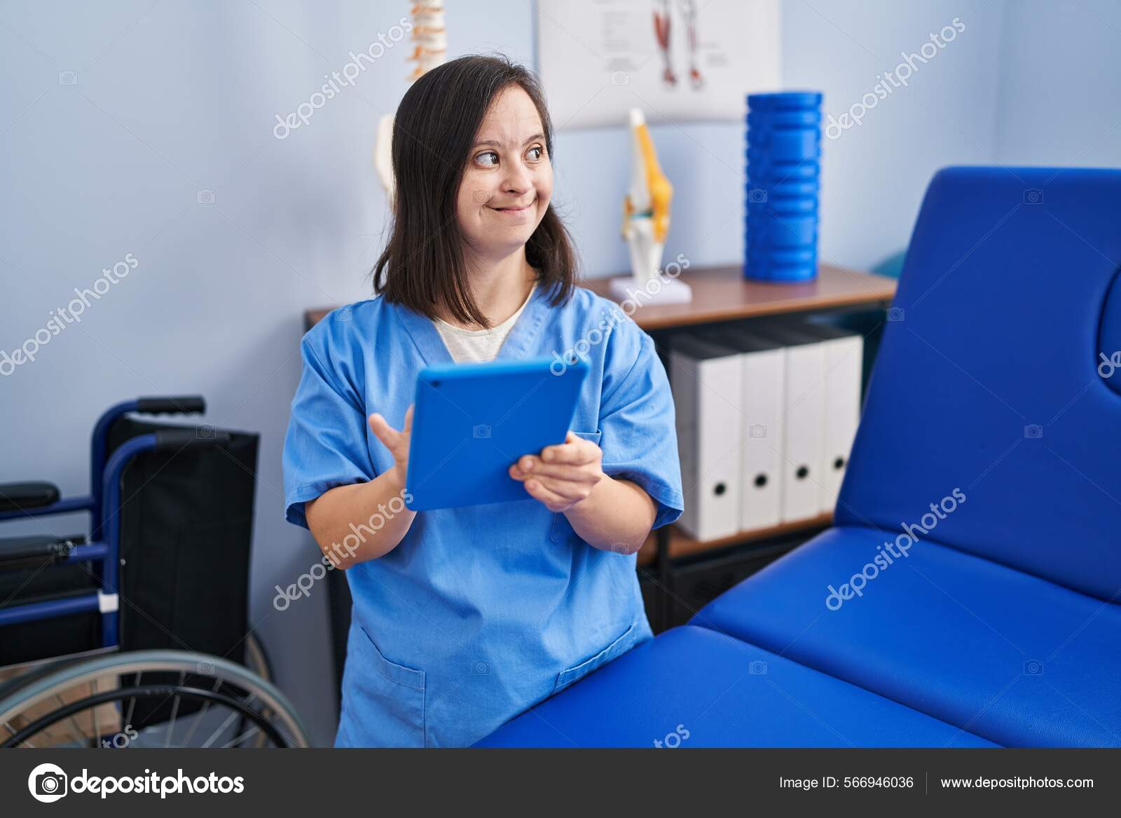 Syndrome Woman Wearing Physiotherapy Uniform Using Touchpad