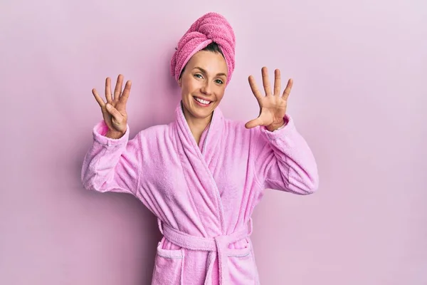 Young Blonde Woman Wearing Shower Towel Cap Bathrobe Showing Pointing — Stockfoto
