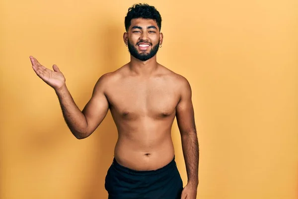 Arab Man Beard Wearing Swimwear Shirtless Smiling Cheerful Presenting Pointing — Stock fotografie