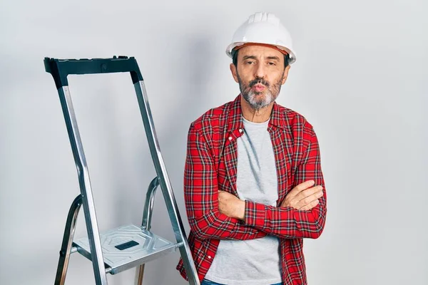 Middle Age Hispanic Worker Man Arms Crossed Gesture Using Ladder — 스톡 사진