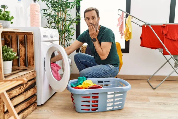 Middle Age Man Beard Putting Laundry Washing Machine Covering Mouth — стоковое фото