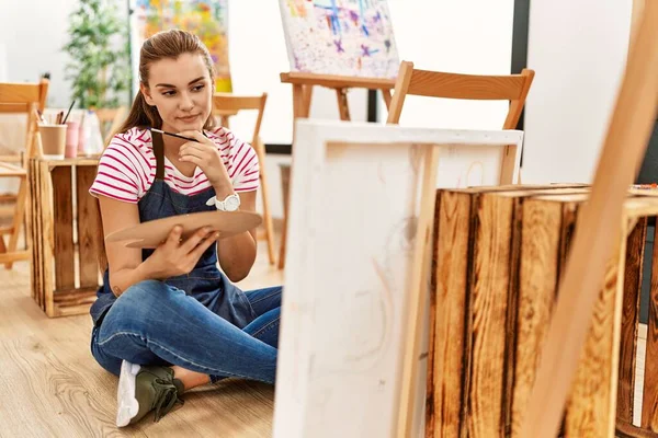 Young woman looking draw at art studio