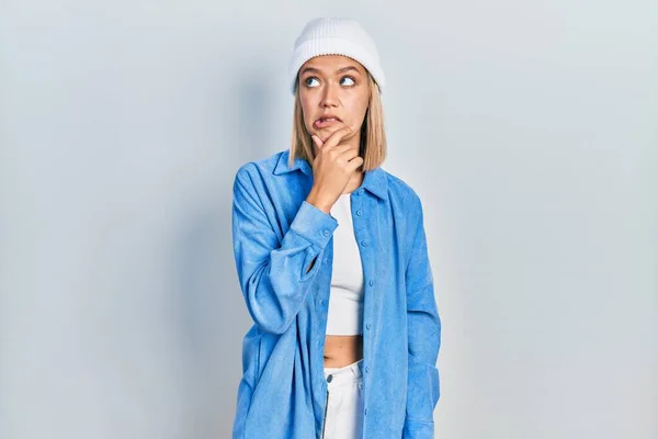 Beautiful Blonde Woman Wearing Wool Hat Thinking Worried Question Concerned — Stok fotoğraf