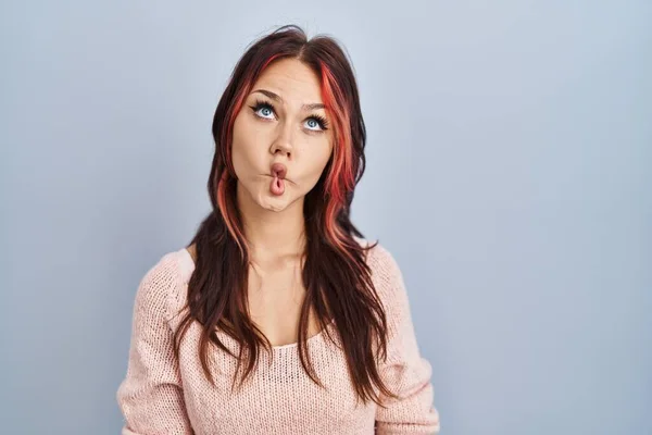 Young Caucasian Woman Wearing Pink Sweater Isolated Background Making Fish — Stock Photo, Image