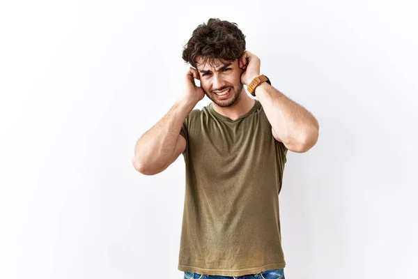 Hispanic Man Standing Isolated White Background Covering Ears Fingers Annoyed — Stock Photo, Image