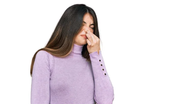 Young Beautiful Teen Girl Wearing Turtleneck Sweater Smelling Something Stinky — Stock Photo, Image