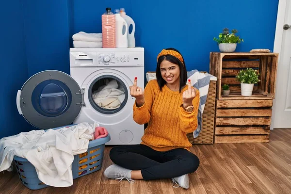 Young Hispanic Woman Doing Laundry Showing Middle Finger Doing Fuck — Stok fotoğraf