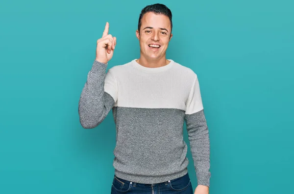 Handsome Young Man Wearing Casual Winter Sweater Pointing Finger Successful — Stock Photo, Image