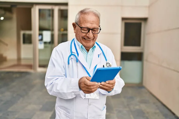 Senior Man Wearing Doctor Uniform Using Touchpad Street — Stockfoto