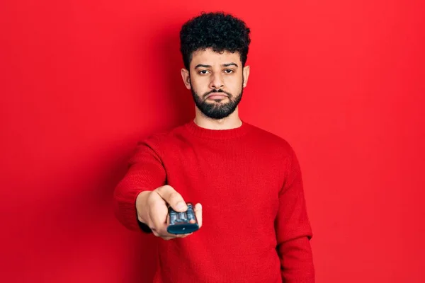 Young Arab Man Beard Holding Television Remote Control Depressed Worry — Stock Photo, Image