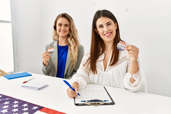 Two Young American Woman Holding Voted Badge Working Electoral Table — Stock Photo, Image
