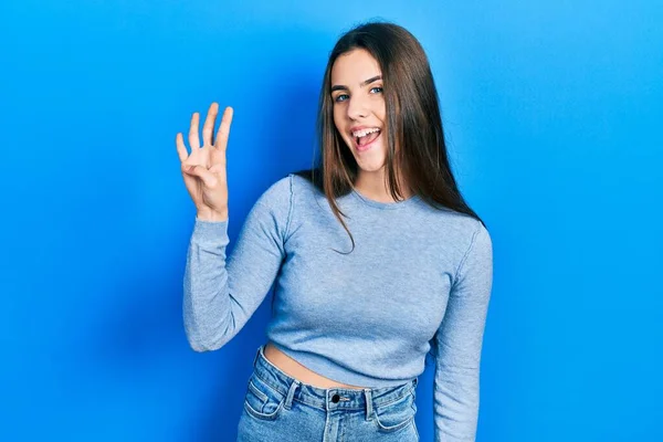 Junge Brünette Teenager Tragen Lässigen Pullover Und Zeigen Mit Finger — Stockfoto