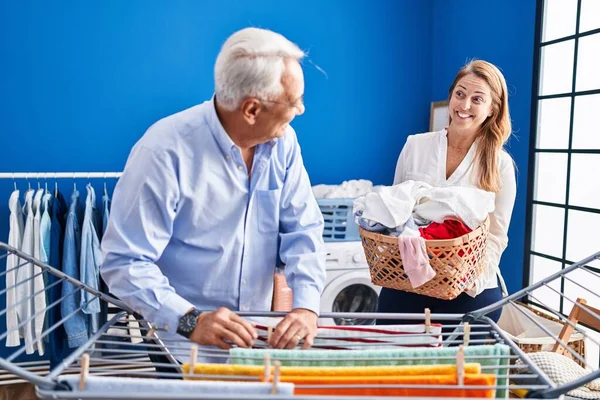 Middle Age Man Woman Couple Hanging Clothes Clothesline Laundry Room — Stock Photo, Image