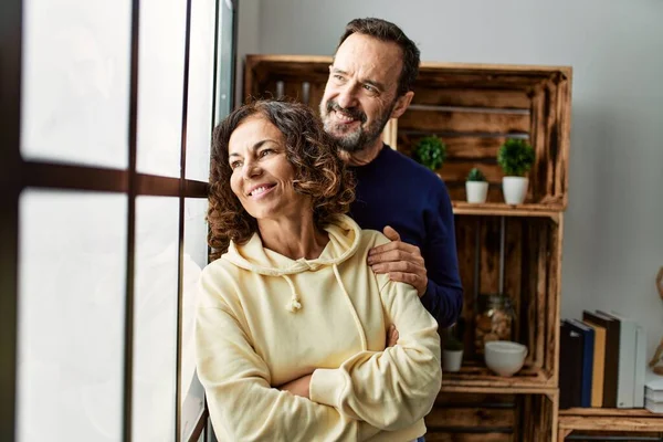 Middle Age Hispanic Couple Smiling Happy Leaning Window Home — Stock Photo, Image