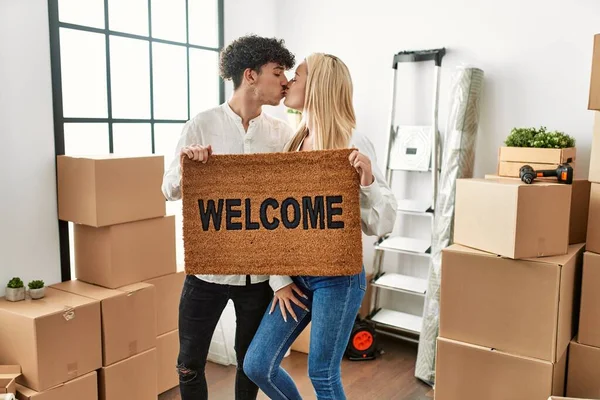 Young Beautiful Couple Kissing Holding Welcome Doormat New Home — Stock Photo, Image