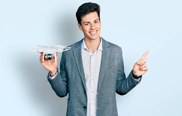 Young Hispanic Business Man Holding Drone Smiling Happy Pointing Hand — Stock Photo, Image