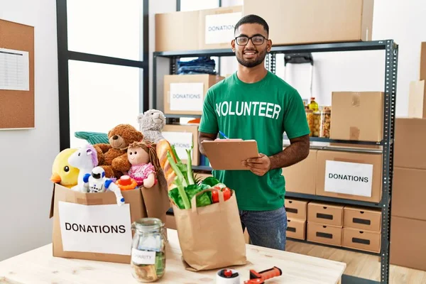 Young Middle East Man Wearing Volunteer Uniform Working Charity Center — Stock Photo, Image