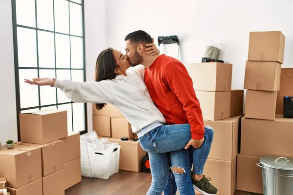 Young Latin Couple Kissing Dancing New Home — Stock Photo, Image