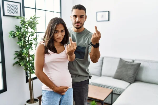 Young Interracial Couple Expecting Baby Touching Pregnant Belly Showing Middle — Fotografia de Stock