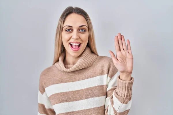 Young Blonde Woman Wearing Turtleneck Sweater Isolated Background Waiving Saying — Stock Photo, Image