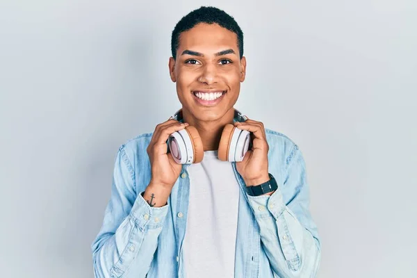 Young African American Guy Listening Music Using Headphones Smiling Happy —  Fotos de Stock