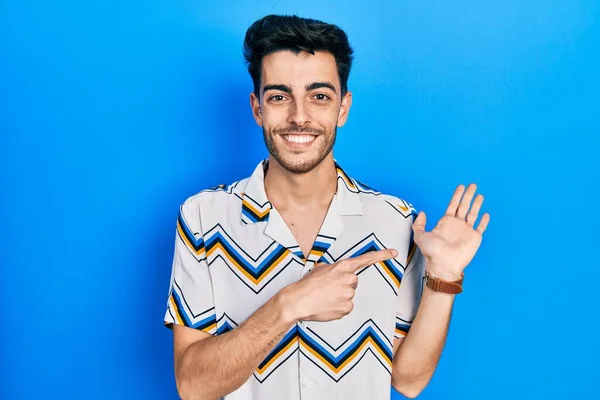 Young Hispanic Man Wearing Casual Clothes Amazed Smiling Camera While — Stock Photo, Image